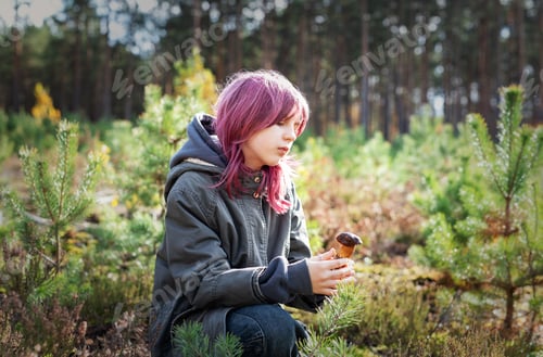 Preview: Girl with pink hair exploring mushroom in forest