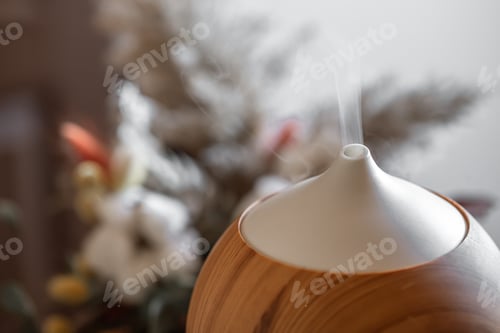 Preview: Modern oil aroma diffuser close up on a blurred background.
