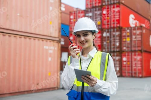 Preview: Engineer port manager communicating in container yard