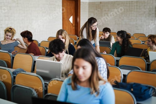Preview: Young students working with tablets inside classroom at school university - Focus on teacher face