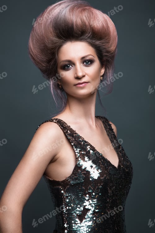 Preview: Beautiful girl in evening dress with avant-garde hairstyles. Beauty the face.