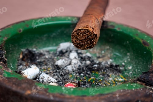 Preview: Closeup shot of a Cuban cigar in an ashtray