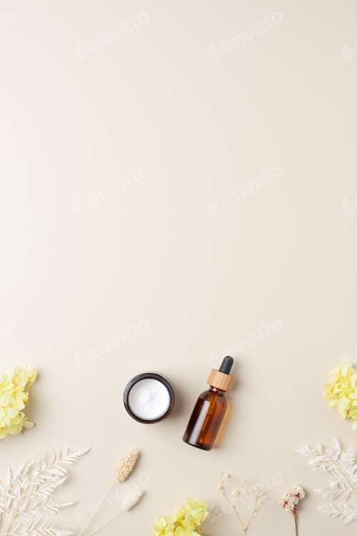 Preview: Cosmetic skin care products with flowers on pastel beige background. Flat lay, copy space
