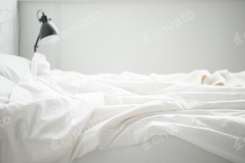 Preview: Selective focus of empty white bad and lamp