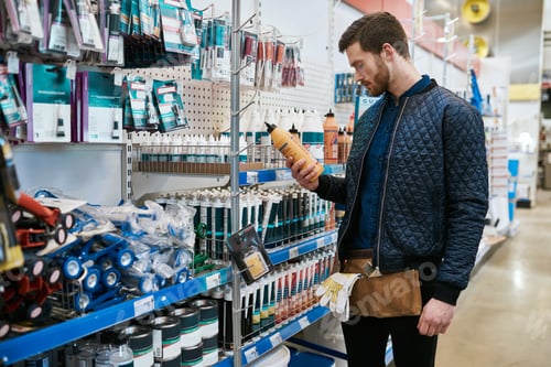 Preview: Young handyman or DIY homeowner in a store