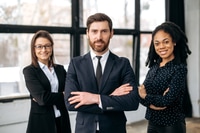 Preview: Successful business partners. Multiracial successful colleagues, dressed in formal wear, standing in