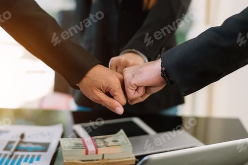 Preview: Teamwork business concept of group of three coworkers join hand