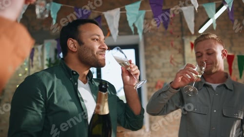 Preview: Joyful coworkers drinking champagne celebrating business win in office close up.