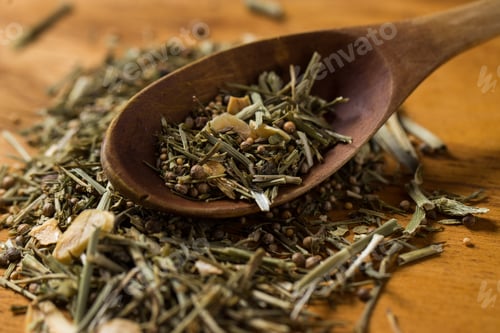 Preview: Spoon and heap of greens on the table