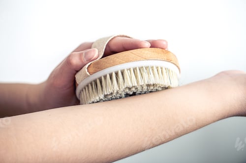 Preview: Female hands massage with a massage brush.