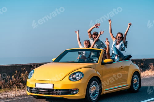 Preview: The four friends fool around in a yellow cabriolet.