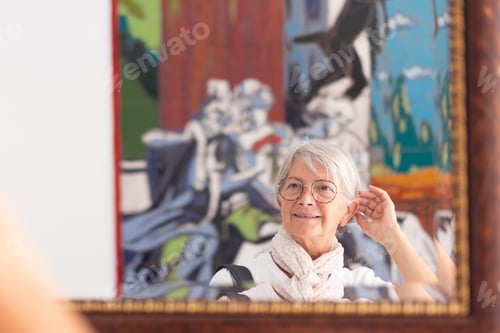 Preview: Portrait of a smiling attractive senior Caucasian woman with white short hair and eyeglasses