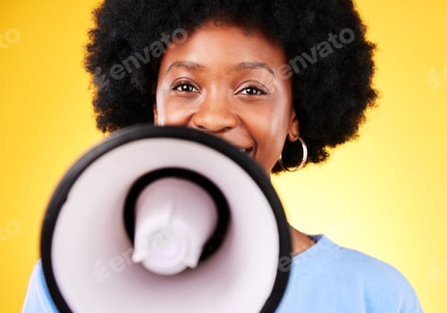 Preview: Happy black woman, portrait and megaphone in advertising or marketing against a yellow studio backg