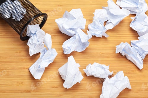 Preview: sheet of paper and crumpled wads on table