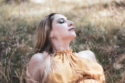 Preview: Happy woman in nature relaxing in the woods in moonlight