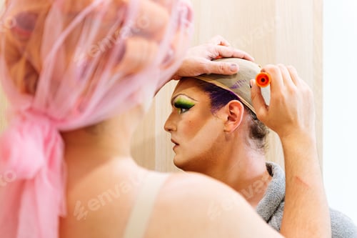 Preview: Men dressing up as drag queens and applying make up