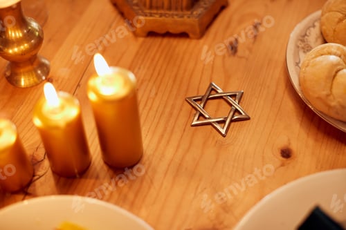 Preview: The star of David on dining table during Hanukkah dinner.