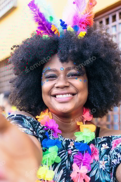 Preview: Young woman taking selfie at a carnival party in the street