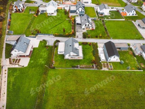 Preview: Plots of land with newly built family houses outside the city in suburban community