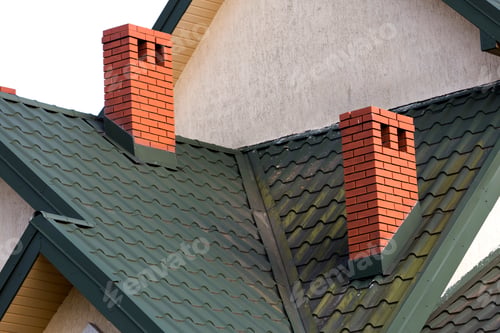 Preview: Close-up detail of new modern house top with shingled green roof