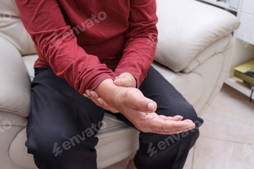 Preview: Senior man hand checking pulse, massage hand