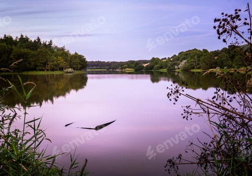 Preview: Breathtaking scenery of the sunset clouds reflecting in the Jaunay lake in France