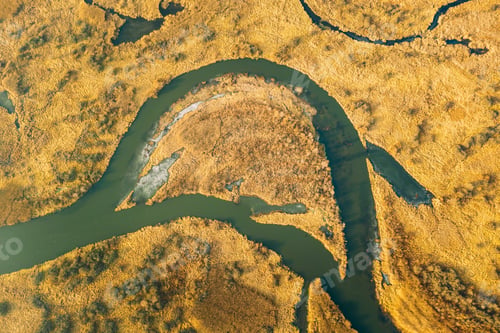 Preview: Aerial View Of Dry Grass And Partly Frozen River Landscape In Late Autumn Day. High Attitude View