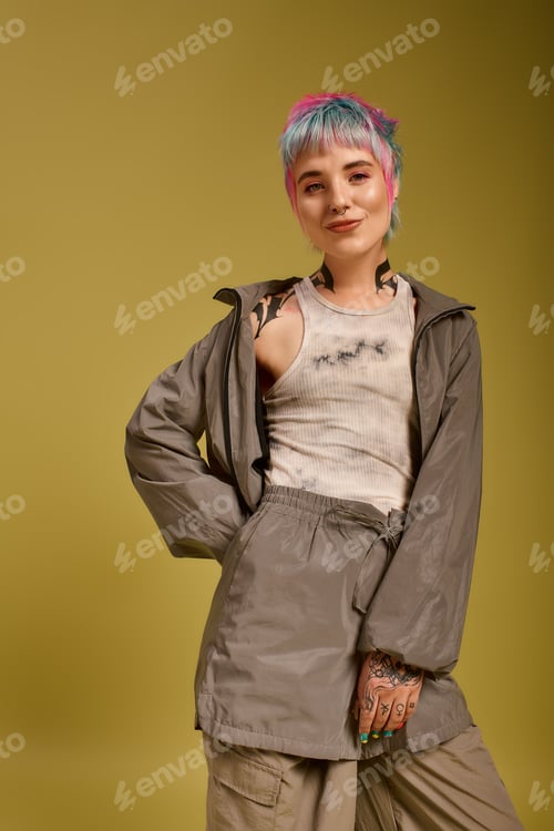 Preview: Young woman showcases colorful style in modern studio setting