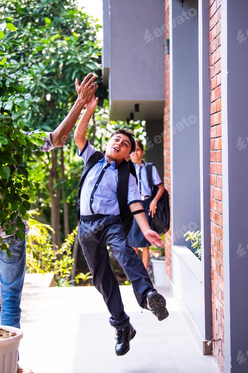 Preview: Indian School kids greeting teacher with hi-five while entering school in uniform happily