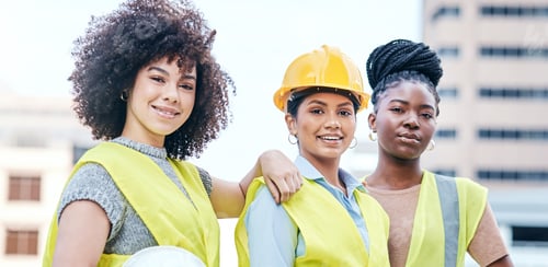 Preview: Portrait of a group of confident young businesswomen working at a construction site