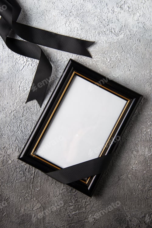 Preview: top view of picture frame with black bow on a white surface tank war death soldier