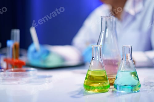 Preview: Chemical solutions in glassware during lab experiment