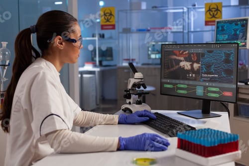 Preview: Science specialist using computer for dna research