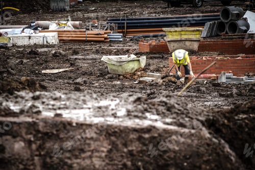 Preview: Workers laying bricks on construction site