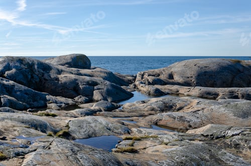 Preview: View of the archipelago in Sweden. Blue sky and sea, cliffs.