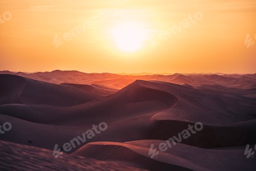 Preview: Sand dunes in desert landscape at beautiful sunset