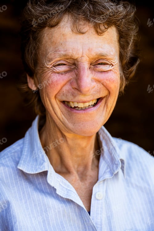 Preview: Portrait of smiling senior woman, looking at camera.