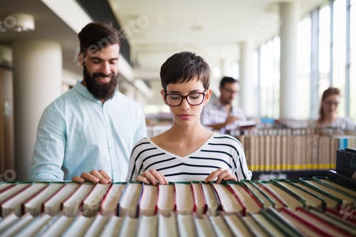 Preview: Group of college students at the library