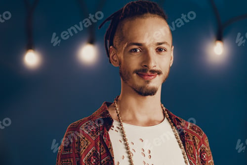 Preview: Close-up portrait of a young stylish man with dreadlocks