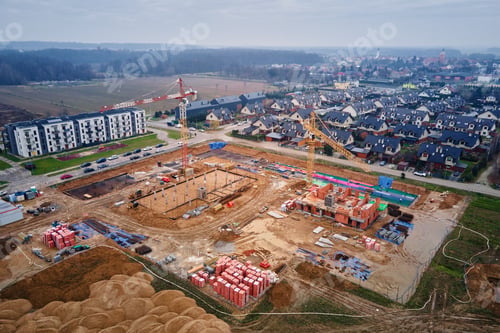 Preview: Construction site with cranes building new houses