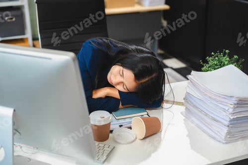 Preview: Asian businesswoman works at office until her body is tired