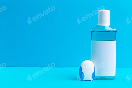 Preview: Bottle of blue mouthwashes. Studio shot