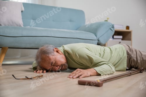 Preview: Older senior man headache lying on the floor after falling