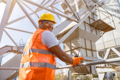 Preview: African male engineer inspecting site at construction plant