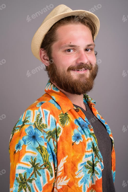 Preview: Smiling Man in Orange Hawaiian Shirt and Straw Hat Portrait - Summer Travel Theme