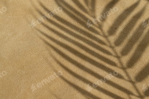 Preview: Brown textile texture, natural canvas background with palm tree leaf shadow