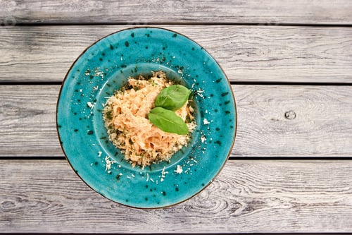 Delicious Pasta Dish with Fresh Basil on Table