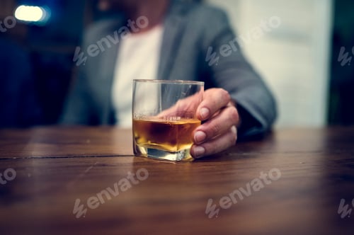 Preview: Shot of a person carrying a glass of alcohol