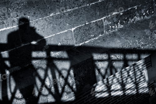 Preview: Silhouette of a man on a wall