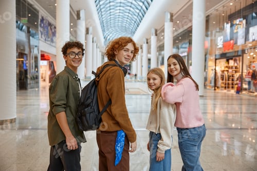 Preview: Group of young friends shopping at big city store center